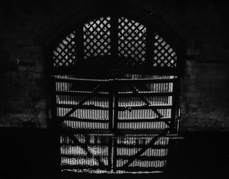 A black and white picture of Traitor's Gate at the Tower of London.